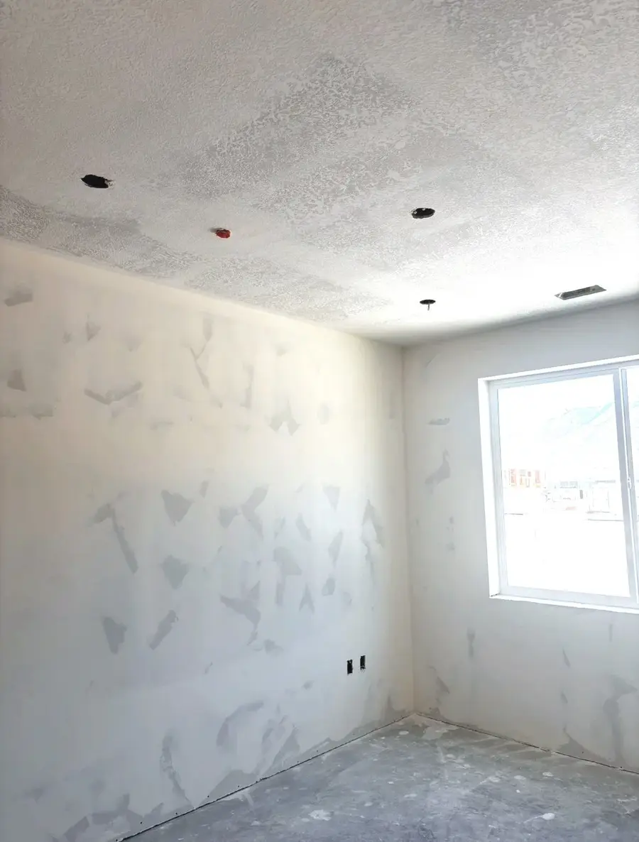 Hand-textured drywall walls in a new room in Logan, Utah
