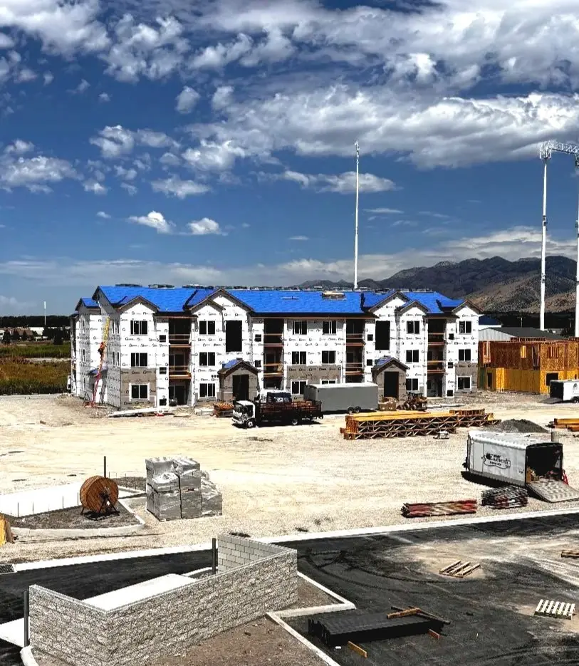 Multi-family building framed by Toro R Services under the Cache Valley, Utah mountains